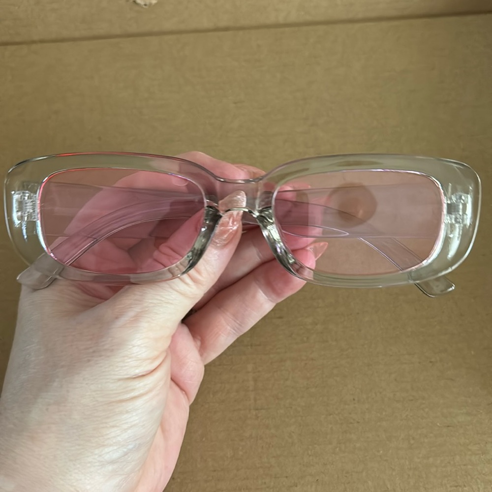Clear with a very slight hint of gray and pink lenses rectangular sunglasses